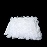 White floral headband on a black background