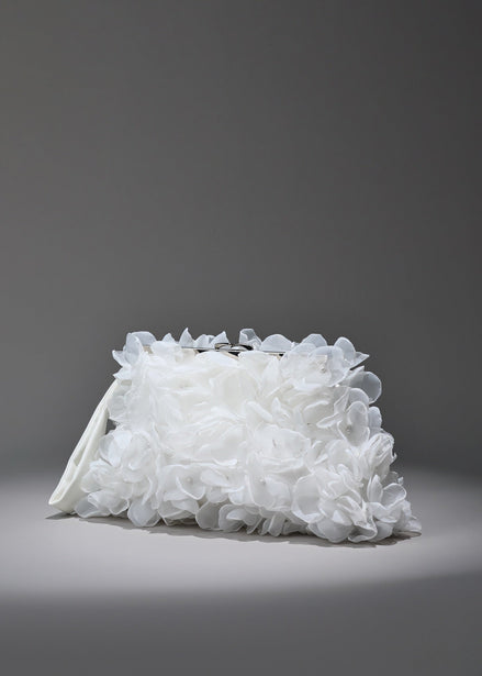 White floral clutch bag on a gray background