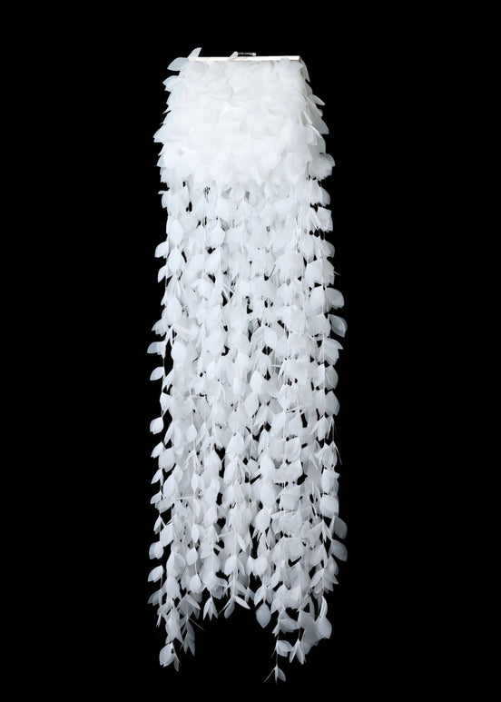White lace curtain against a black background
