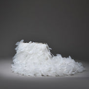 White shoe made of small crystals on a dark gray background