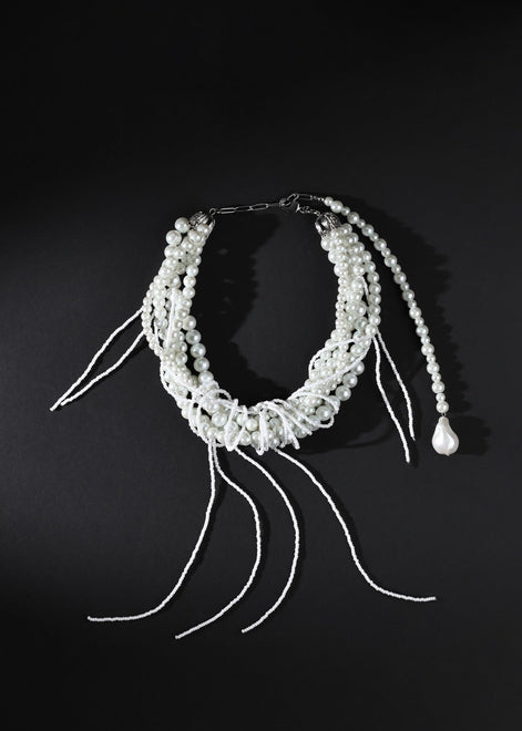 Pearl hair accessory on a black background