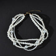 Pearl necklace on a black background