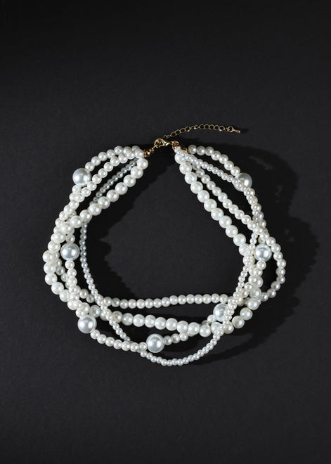 Pearl necklace on a black background