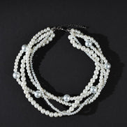 Pearl necklace on a black background