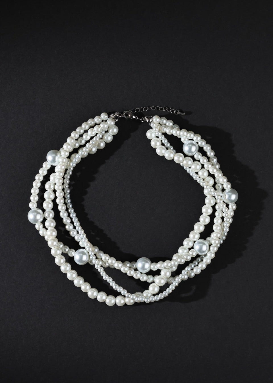 Pearl necklace on a black background