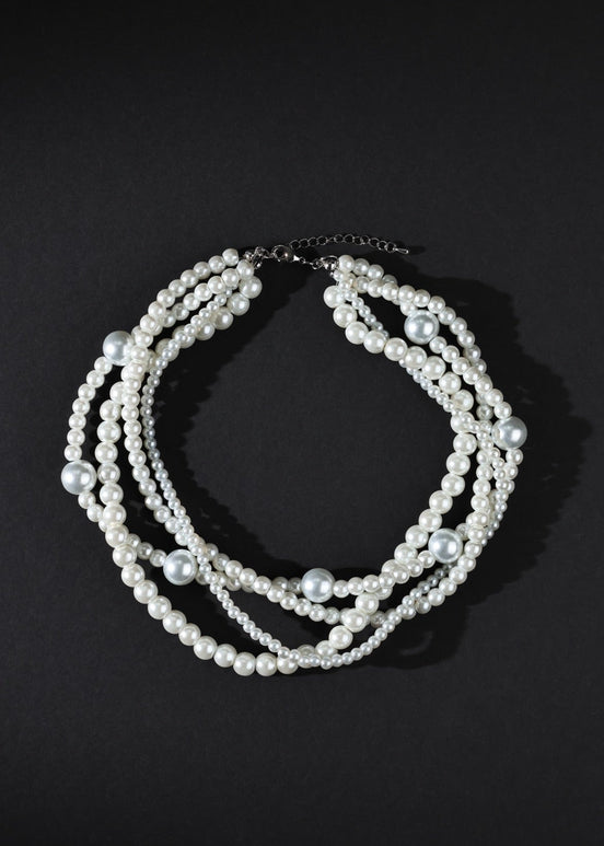 Pearl necklace on a black background