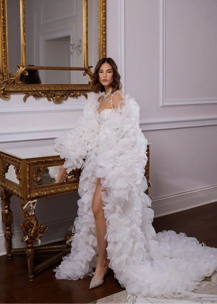 Woman in a white floral gown by Linni Caro