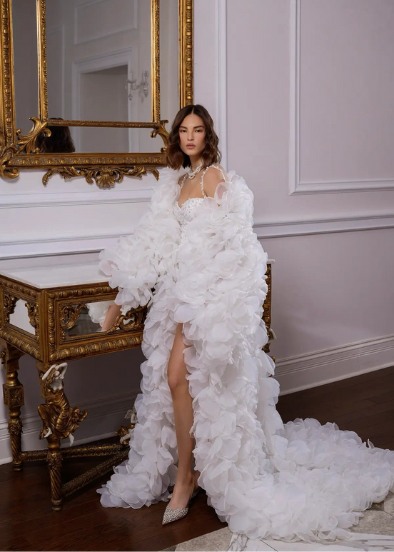 Woman in a white floral gown by Linni Caro