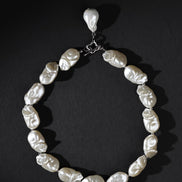 Pearl necklace on a black background