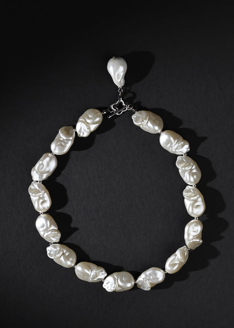 Pearl necklace on a black background